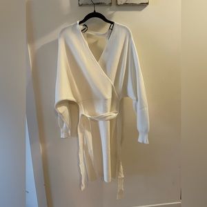 Knee length white sweater dress with tie